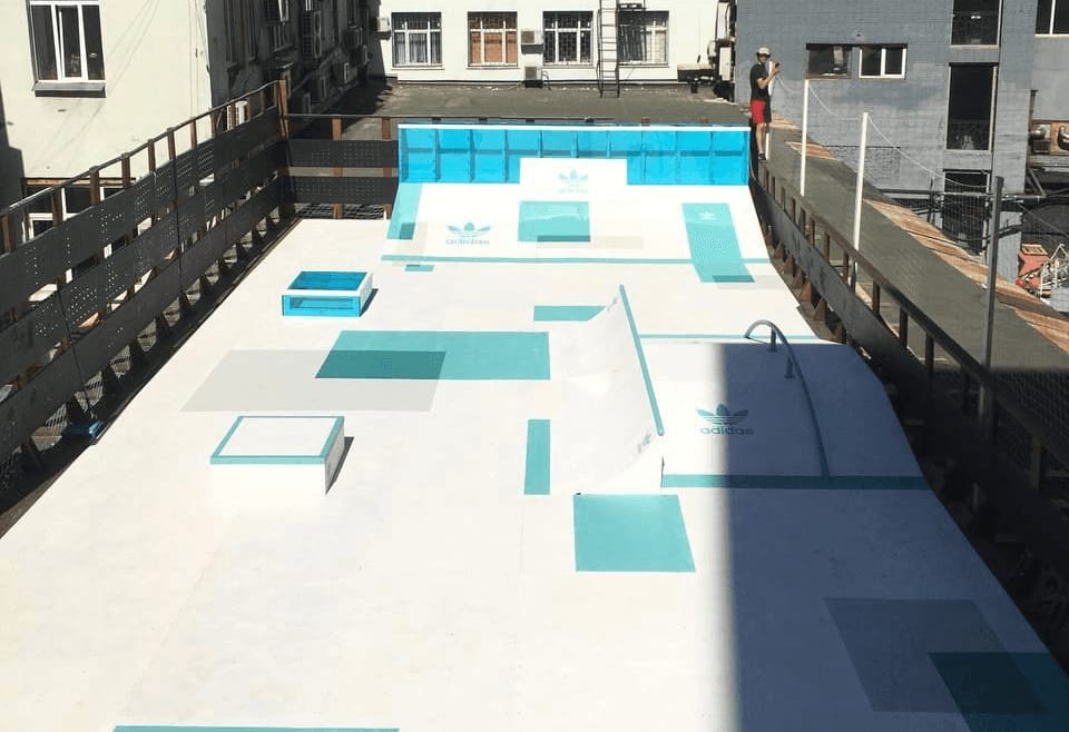 Adidas park course with quarter pipes, boxes, a bank and a rail, finished in white and turquoise