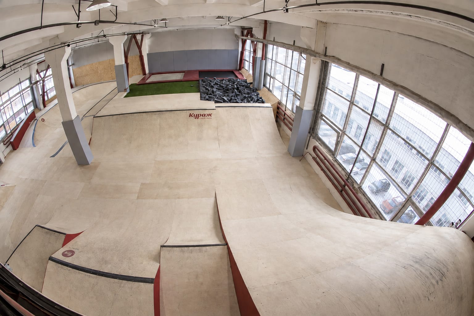 Kurazh Park overview with quarter pipes, a mini ramp and the foam pit by the windows