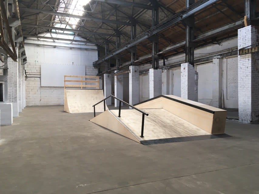 Wooden bank with a steel handrail and a quarter pipe built for the Format festival in Minsk