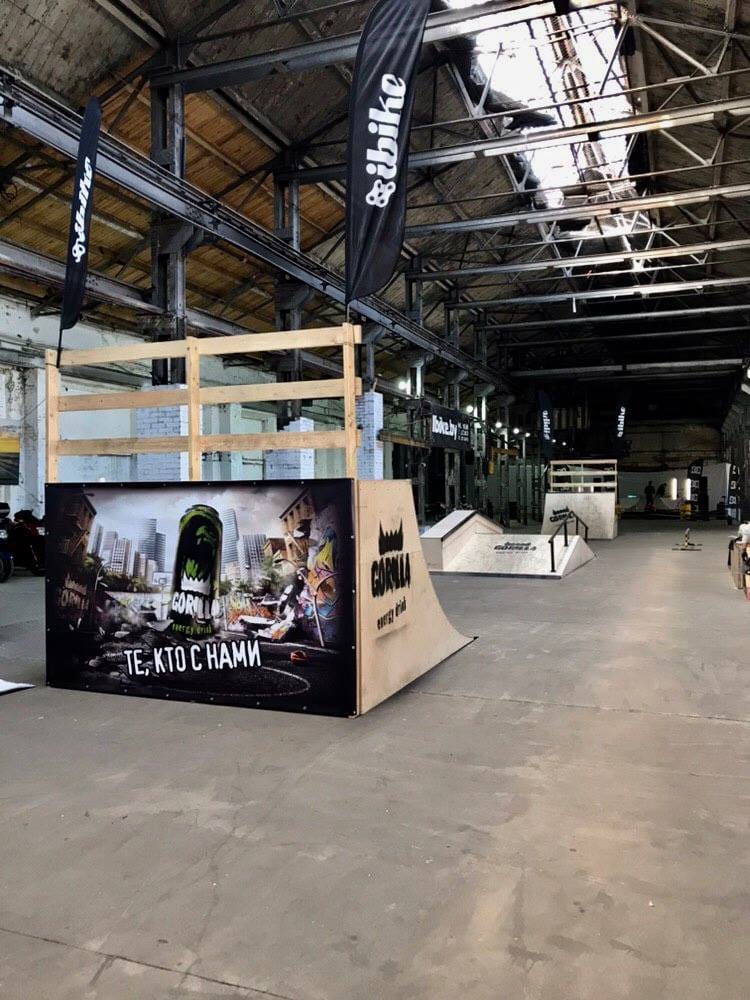 Festival quarter pipe wrapped in event branding in a Minsk industrial hall
