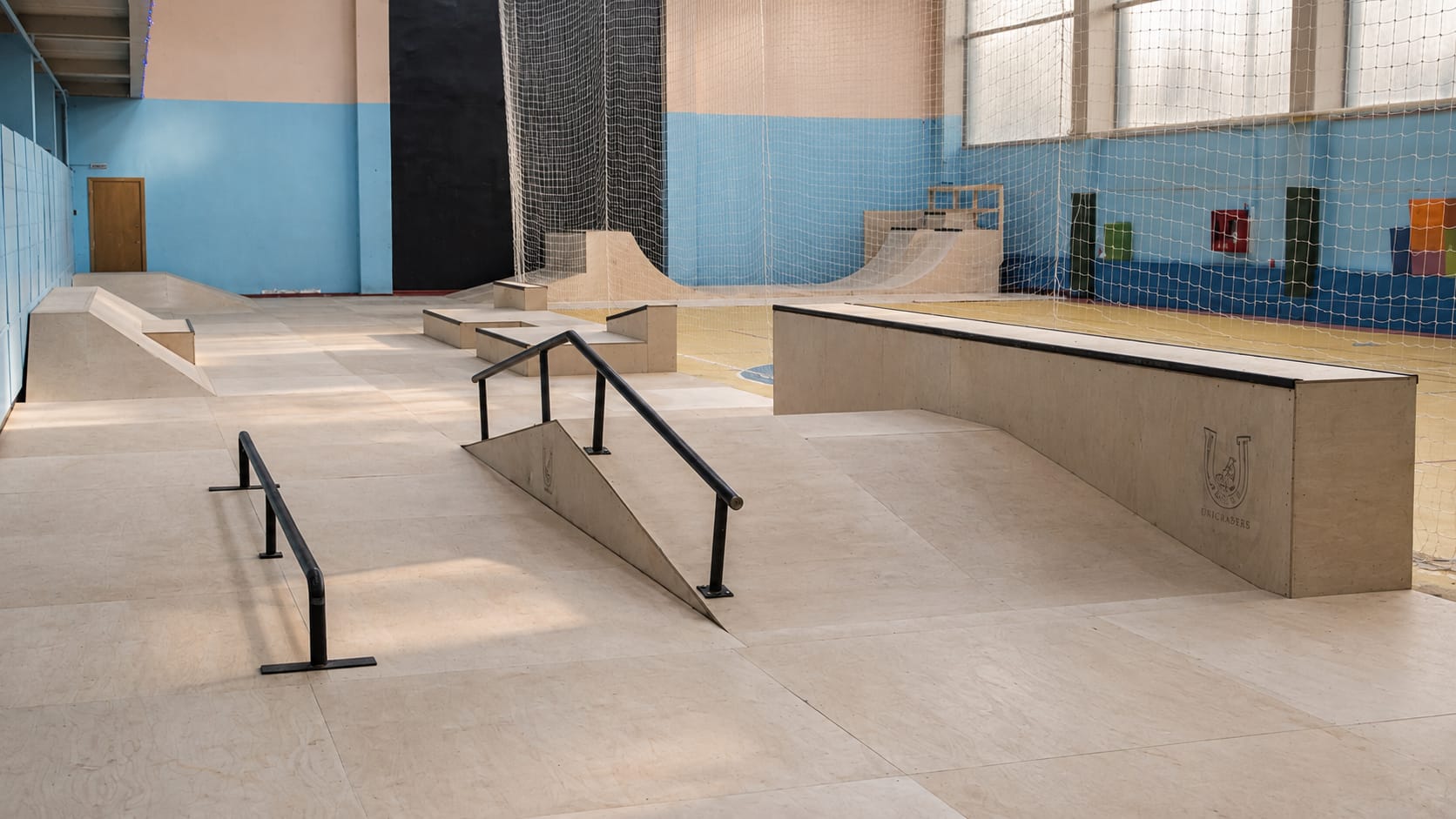 Flat and down rails, a hubba ledge and quarter pipes at SPOT Omsk