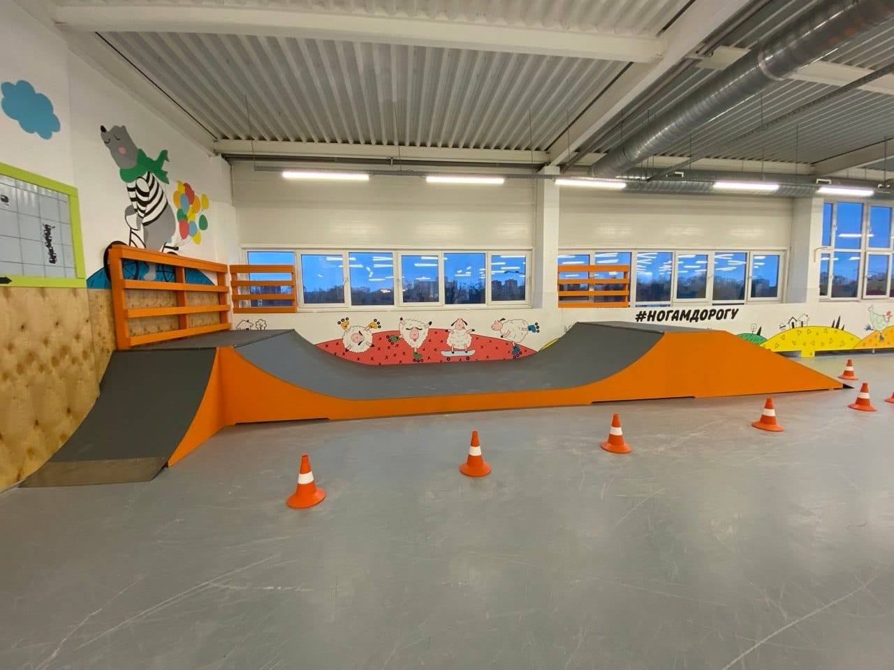 Orange and grey wave section with a roll-in along the wall of the Nogam Dorogu training hall