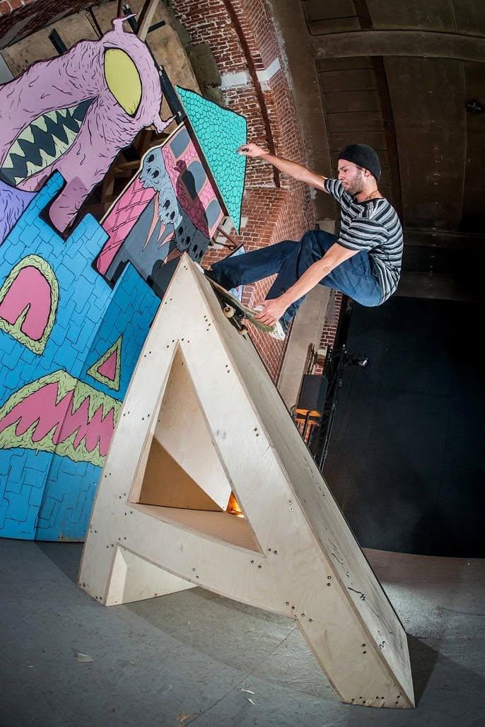 Skater riding the letter-shaped “A” obstacle built for Absurd Skateboards