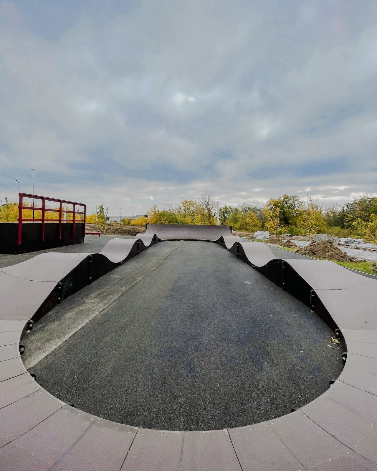 Pump track with rolling wooden berms at the Ust-Donetsky skatepark