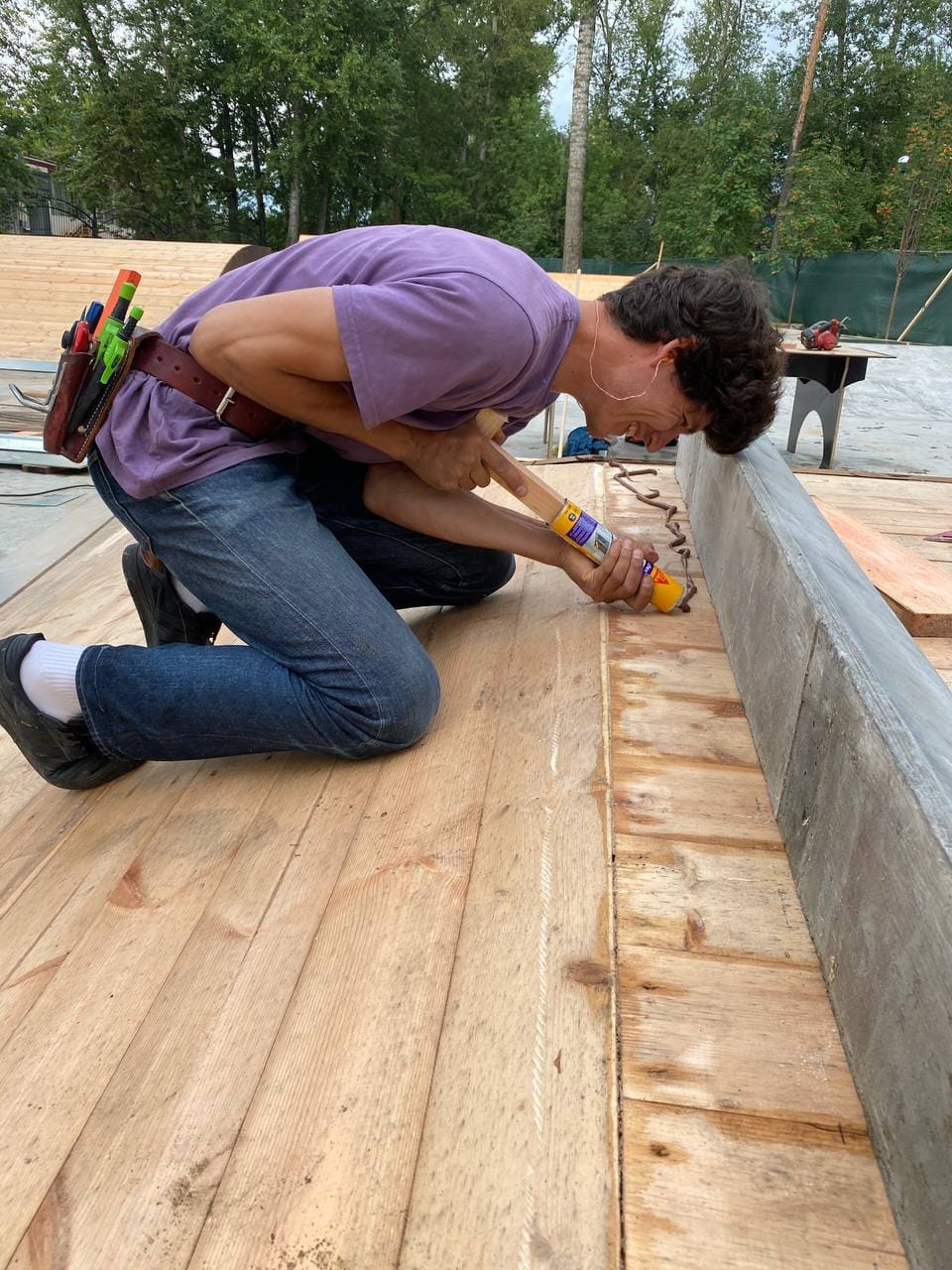 Crew member fitting the deck of a ramp on site